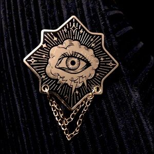 Gold colored third eye metal brooch with chains